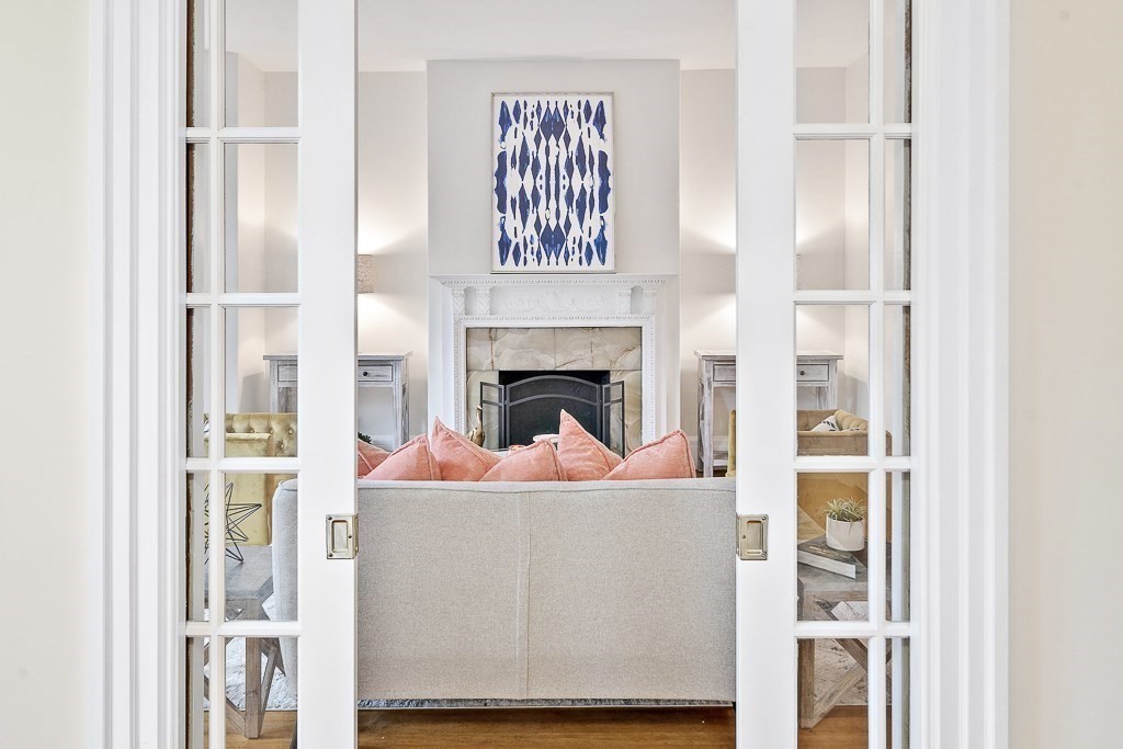 382 Commonwealth Avenue, Unit 24 Boston, MA 02215 - Photo 12 of 36 a living room with a fireplace furniture and a fireplace