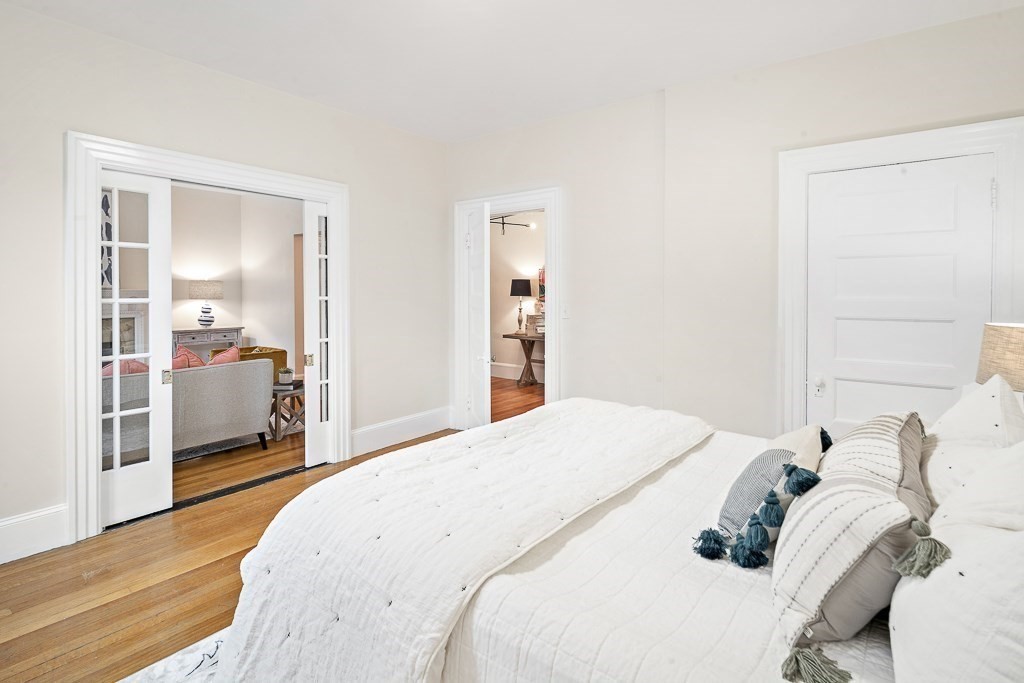 382 Commonwealth Avenue, Unit 24 Boston, MA 02215 - Photo 13 of 36 a bedroom with a bed and a large mirror