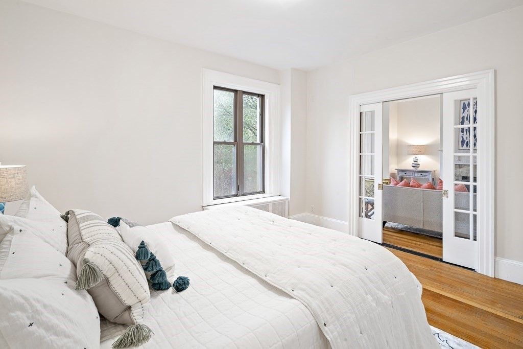 382 Commonwealth Avenue, Unit 24 Boston, MA 02215 - Photo 14 of 36 a bedroom with a bed and a window