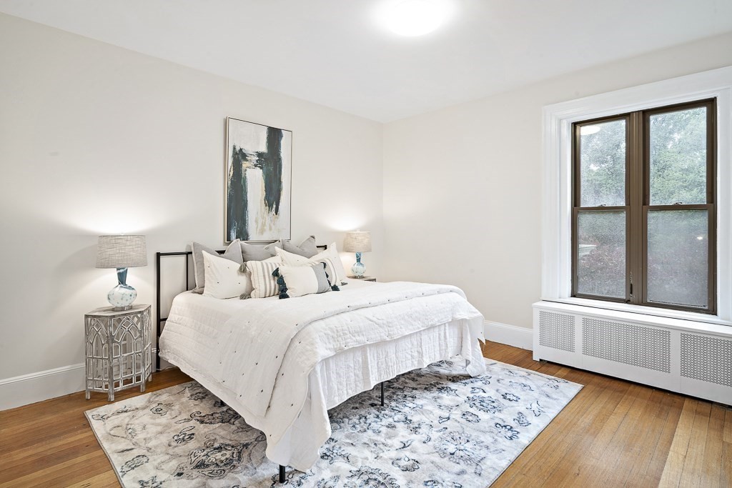 382 Commonwealth Avenue, Unit 24 Boston, MA 02215 - Photo 15 of 36 a bedroom with a large bed and a window