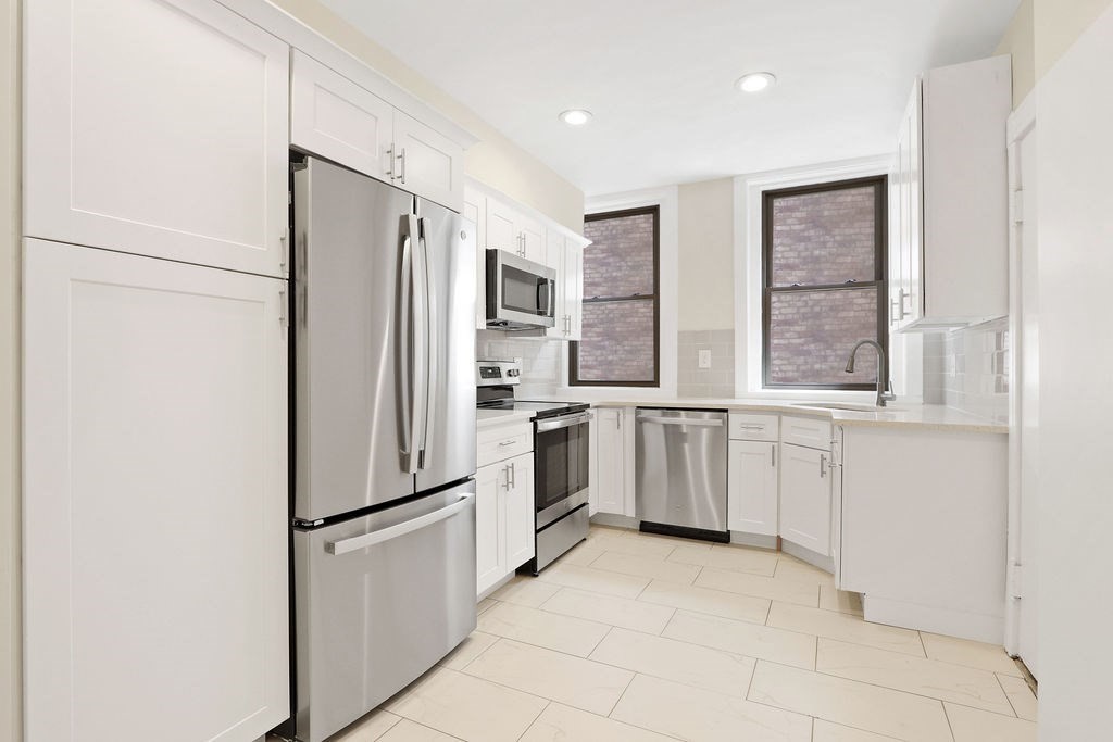 382 Commonwealth Avenue, Unit 24 Boston, MA 02215 - Photo 19 of 36 a kitchen with stainless steel appliances a refrigerator sink and cabinets