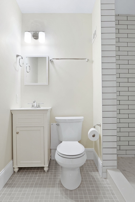 382 Commonwealth Avenue, Unit 24 Boston, MA 02215 - Photo 21 of 36 a white toilet sitting next to a bathroom sink