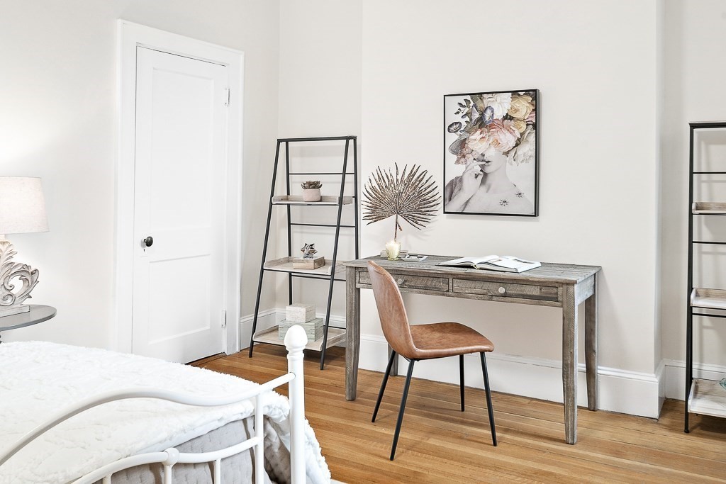 382 Commonwealth Avenue, Unit 24 Boston, MA 02215 - Photo 23 of 36 a bedroom with a bed and a workspace