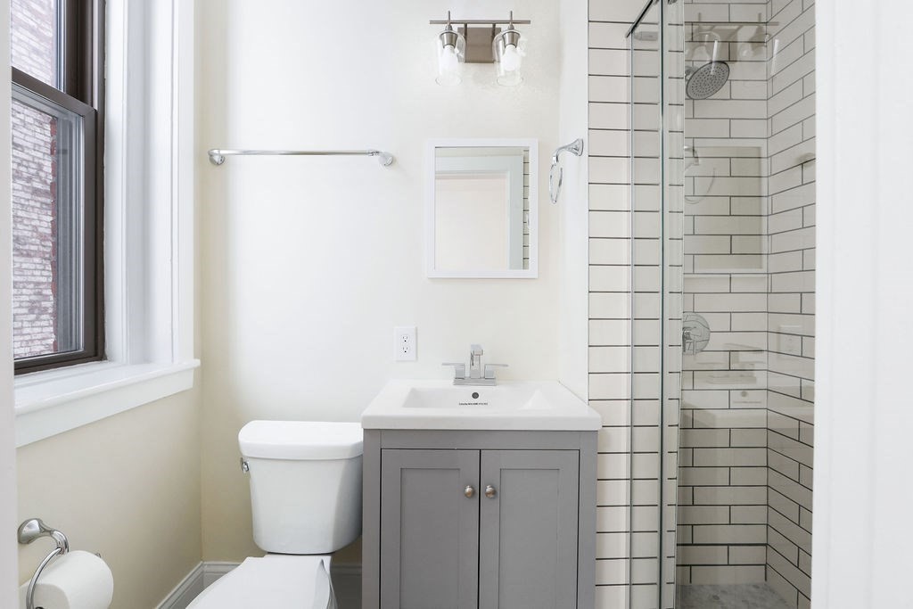 382 Commonwealth Avenue, Unit 24 Boston, MA 02215 - Photo 26 of 36 a bathroom with a toilet sink and shower