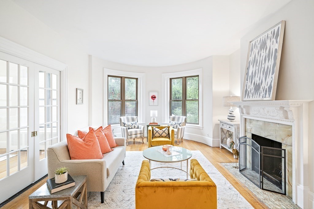 382 Commonwealth Avenue, Unit 24 Boston, MA 02215 - Photo 4 of 36 a living room with furniture and a fireplace