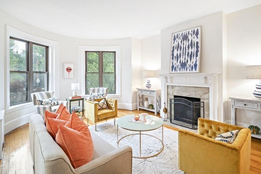 382 Commonwealth Avenue, Unit 24 Boston, MA 02215 - Photo 7 of 36 a living room with furniture fireplace and a large window