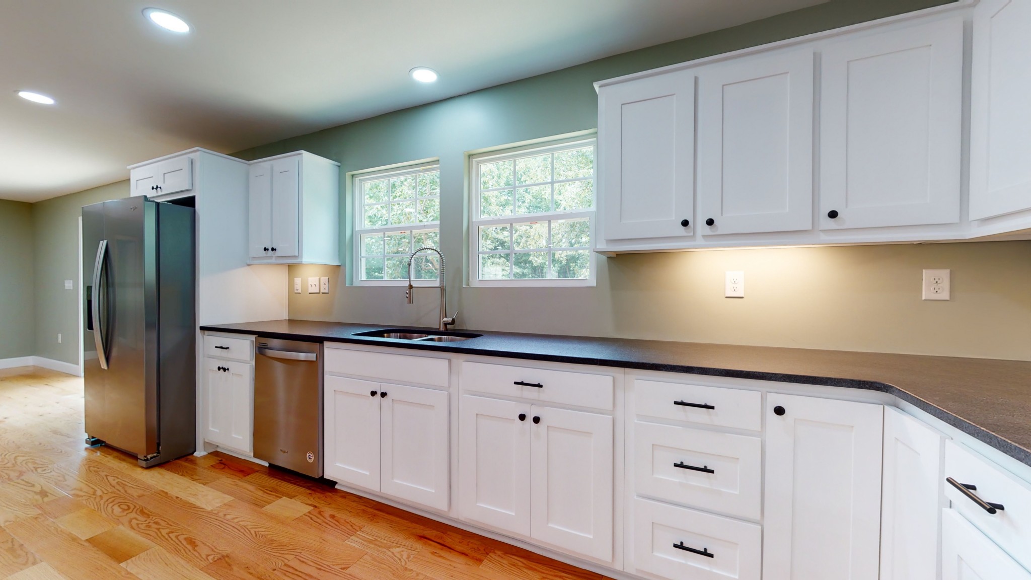 266 Lake Forrest Road Lynchburg, TN 37352 - Photo 21 of 40 a kitchen with granite countertop white cabinets and stainless steel appliances