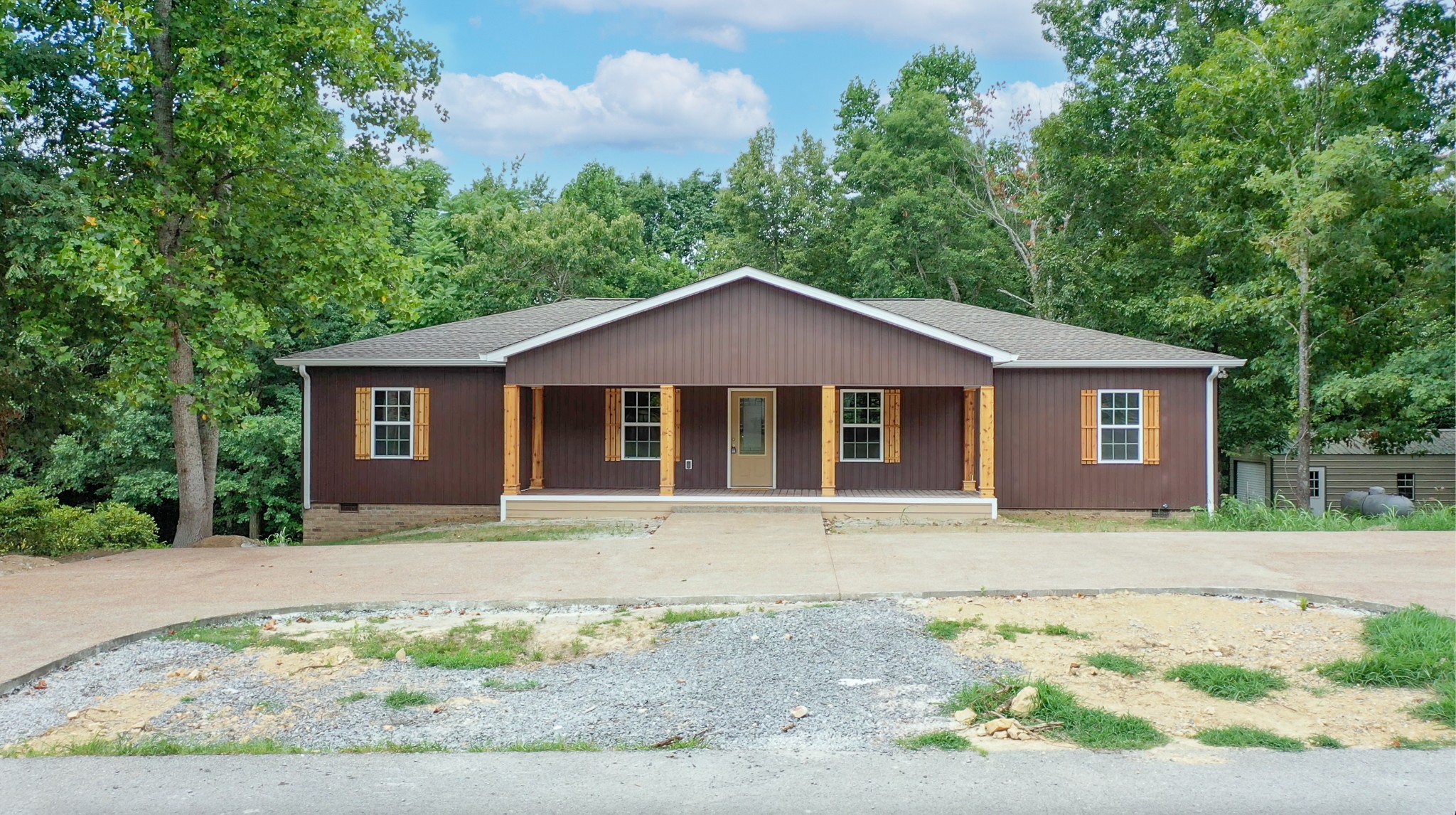 266 Lake Forrest Road Lynchburg, TN 37352 - Photo 3 of 40 a front view of a house with a garden