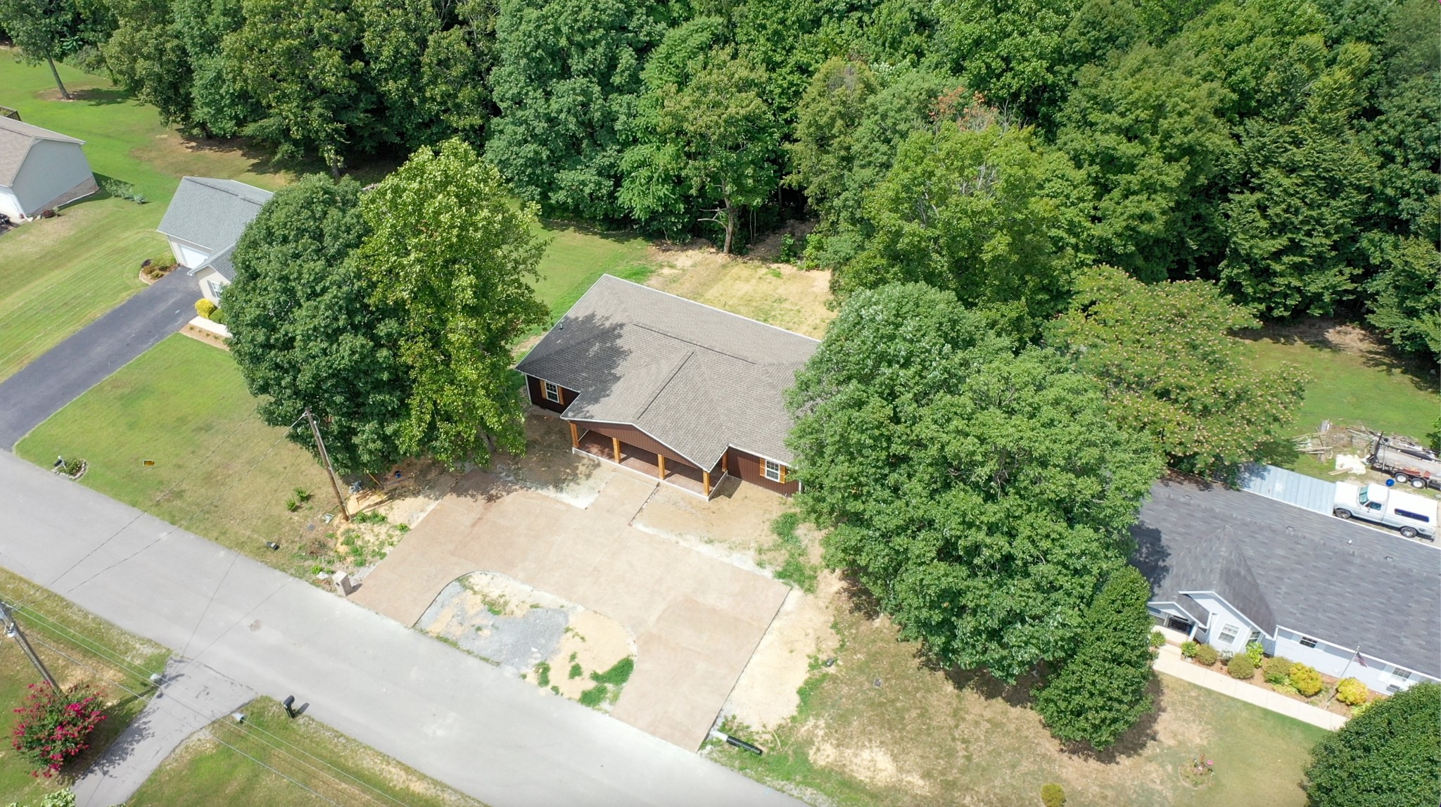 266 Lake Forrest Road Lynchburg, TN 37352 - Photo 6 of 40 an aerial view of a house with a yard and trees