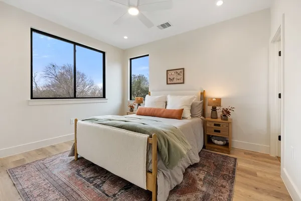 a bed room with a bed and a painting