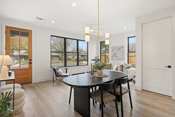 a view of a dining room with furniture window and wooden floor