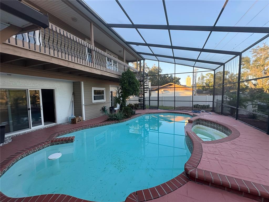 3904 Sweetleaf Drive Brandon, FL 33511 - Photo 12 of 34 a view of a swimming pool with a patio