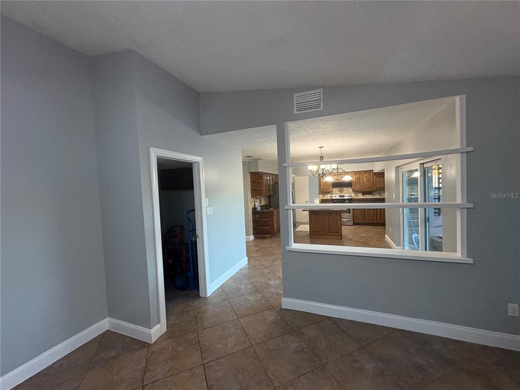 3904 Sweetleaf Drive Brandon, FL 33511 - Photo 21 of 34 an empty room with a kitchen and windows