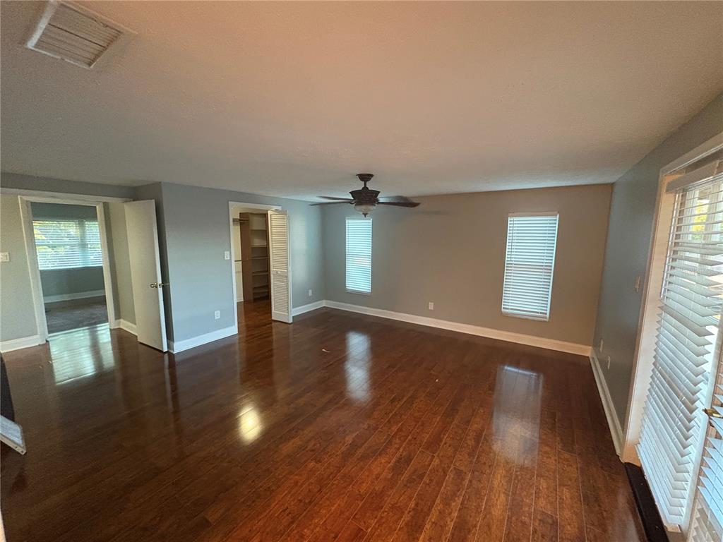 3904 Sweetleaf Drive Brandon, FL 33511 - Photo 26 of 34 wooden floor in an empty room with a window