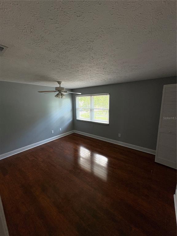 3904 Sweetleaf Drive Brandon, FL 33511 - Photo 31 of 34 a view of empty room with wooden floor and fan