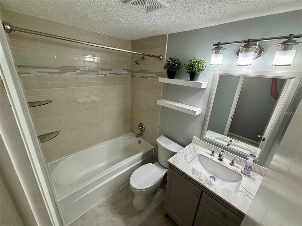 3904 Sweetleaf Drive Brandon, FL 33511 - Photo 33 of 34 a bathroom with a sink toilet and shower