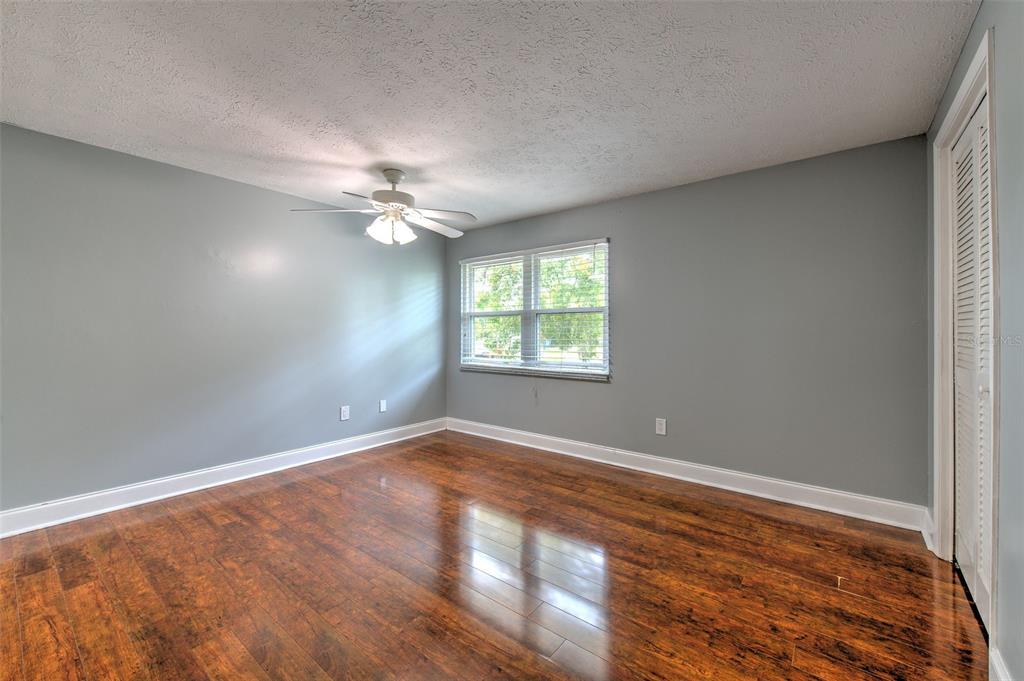 3904 Sweetleaf Drive Brandon, FL 33511 - Photo 40 of 66 an empty room with windows and fan