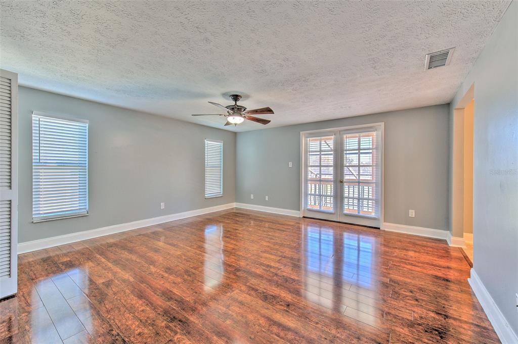 3904 Sweetleaf Drive Brandon, FL 33511 - Photo 46 of 66 a view of an empty room with wooden floor and a window
