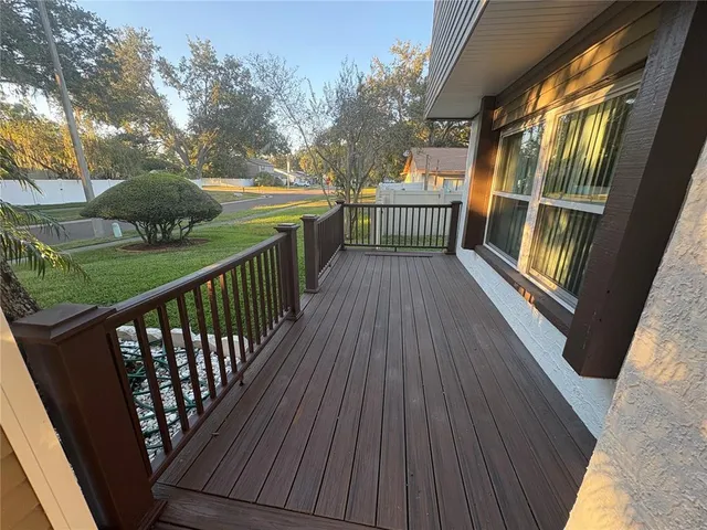 a view of deck with wooden floor and outdoor seating