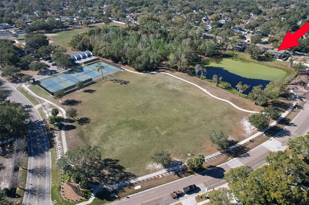 3904 Sweetleaf Drive Brandon, FL 33511 - Photo 62 of 66 an aerial view of a house with a yard and lake view