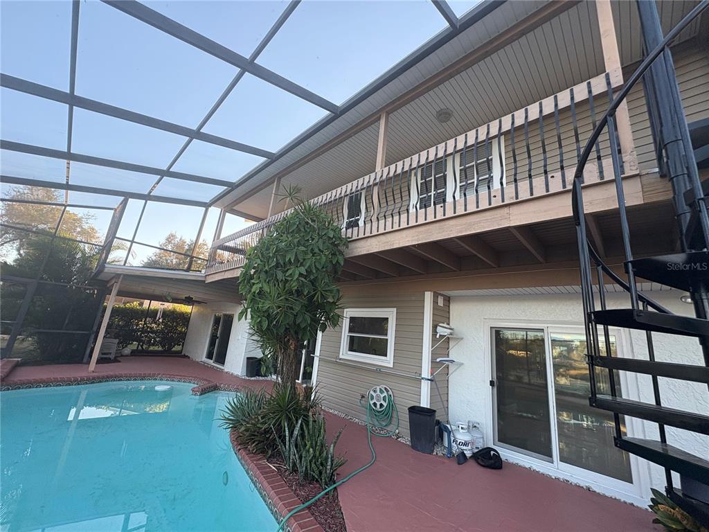 3904 Sweetleaf Drive Brandon, FL 33511 - Photo 10 of 34 a balcony with table and chairs