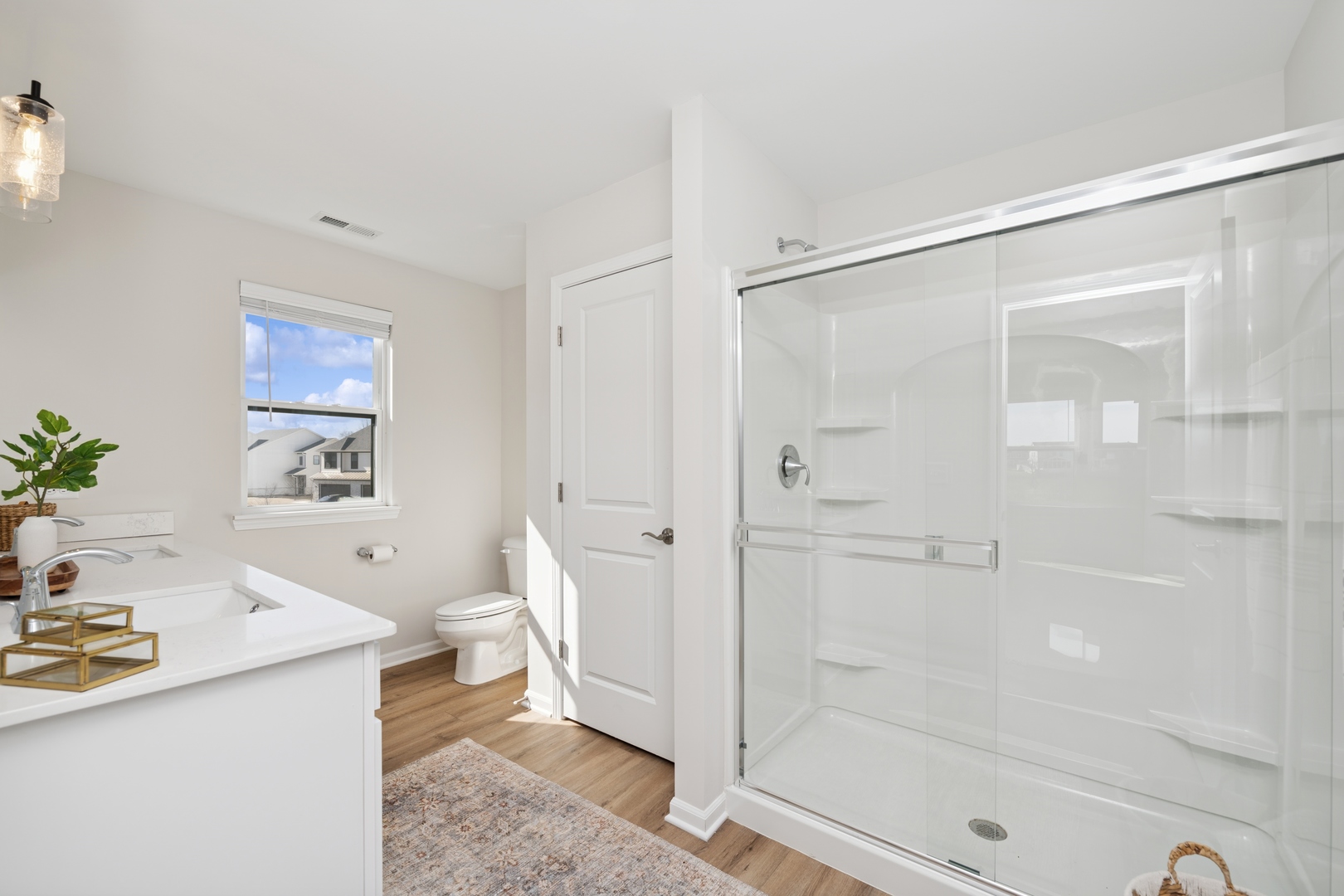 271 Barrett Drive Yorkville, IL 60560 - Photo 12 of 16 a bathroom with a sink a toilet and shower