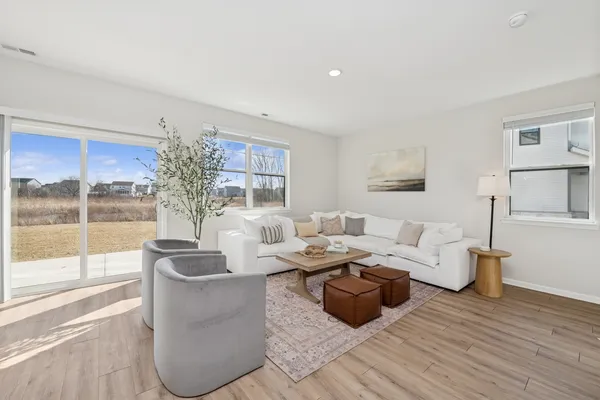 a living room with furniture and a large window