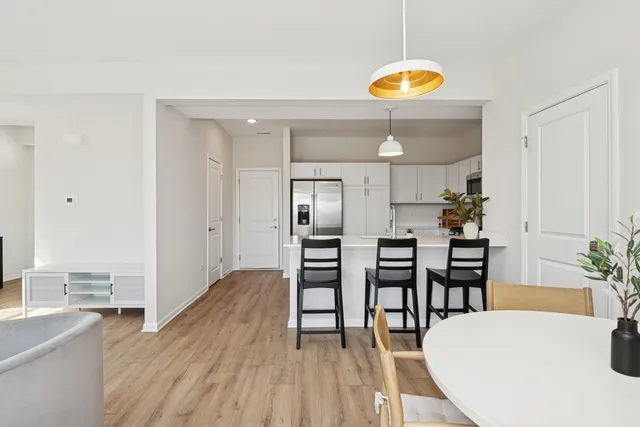 a kitchen with a table and chairs