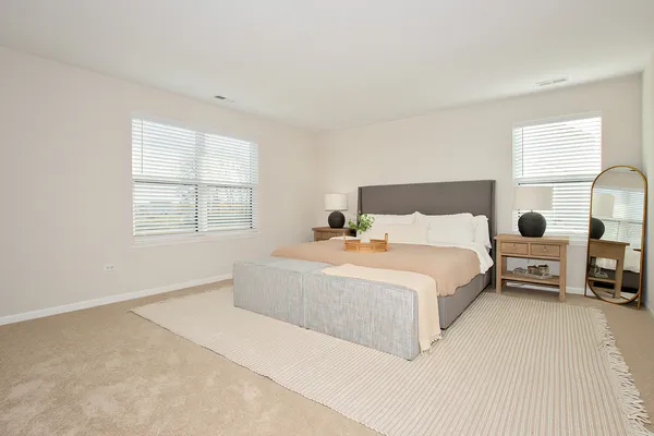 a bedroom with a bed and window