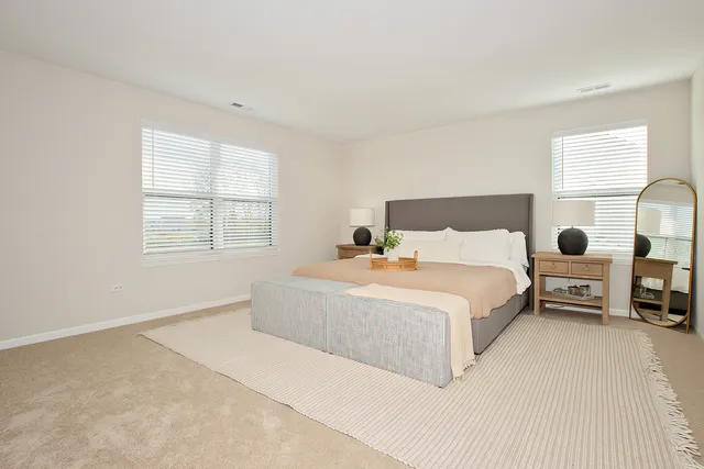 a bedroom with a bed and window