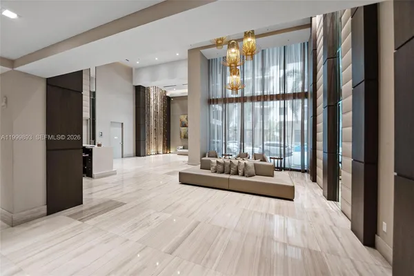 a spacious bedroom with a large bed and a large window