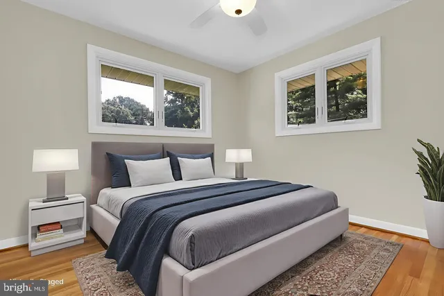 a bedroom with bed and a window