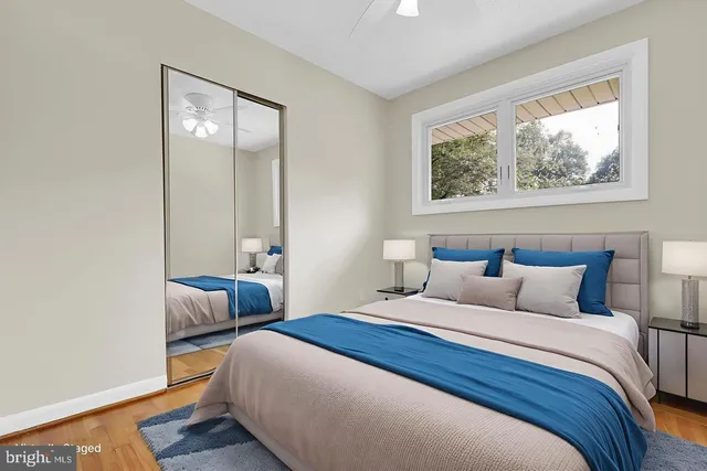 a bedroom with bed and window