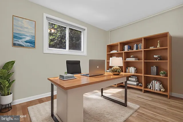 a workspace with furniture and wooden floor