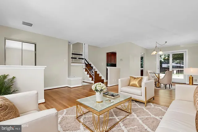 a living room with furniture and a table