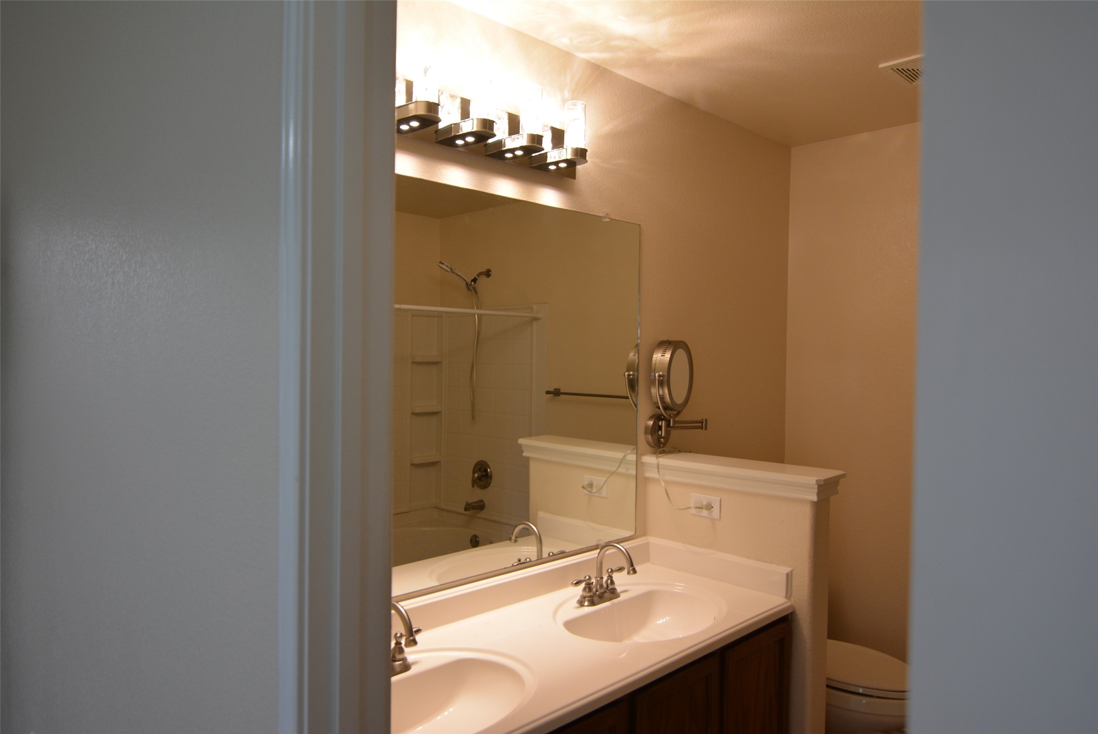 1303 Horseshoe Ranch Drive Leander, TX 78641 - Photo 13 of 26 Double vanity sinks and bright overhead lighting define this functional, appealing bathroom space.