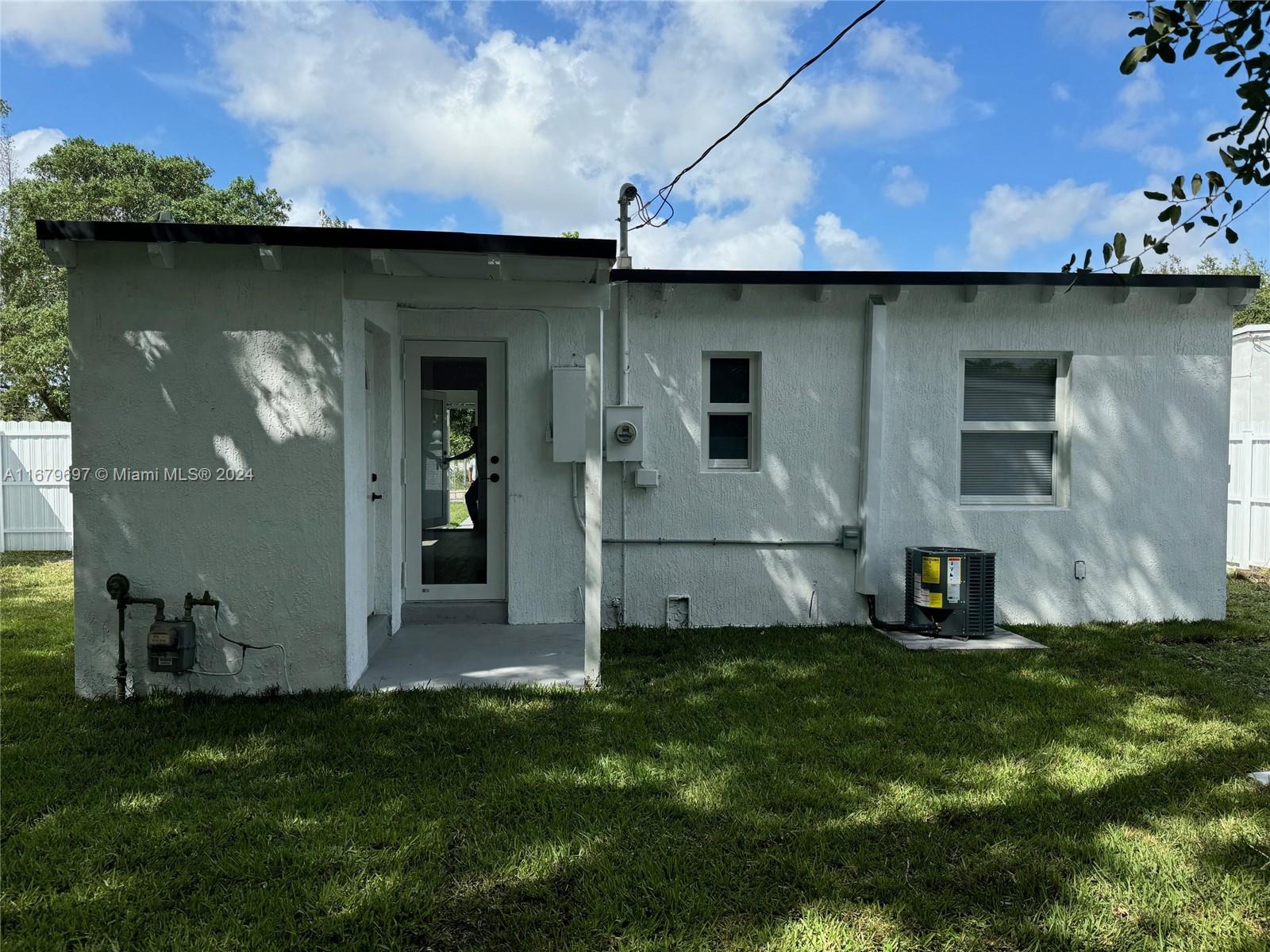 1830 Service Road Opa-Locka, FL 33054 - Photo 24 of 39 a view of a back yard of the house