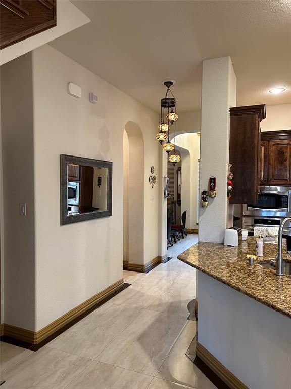 2219 Longview Road Irving, TX 75063 - Photo 13 of 36 a spacious bathroom with a granite countertop sink and a mirror