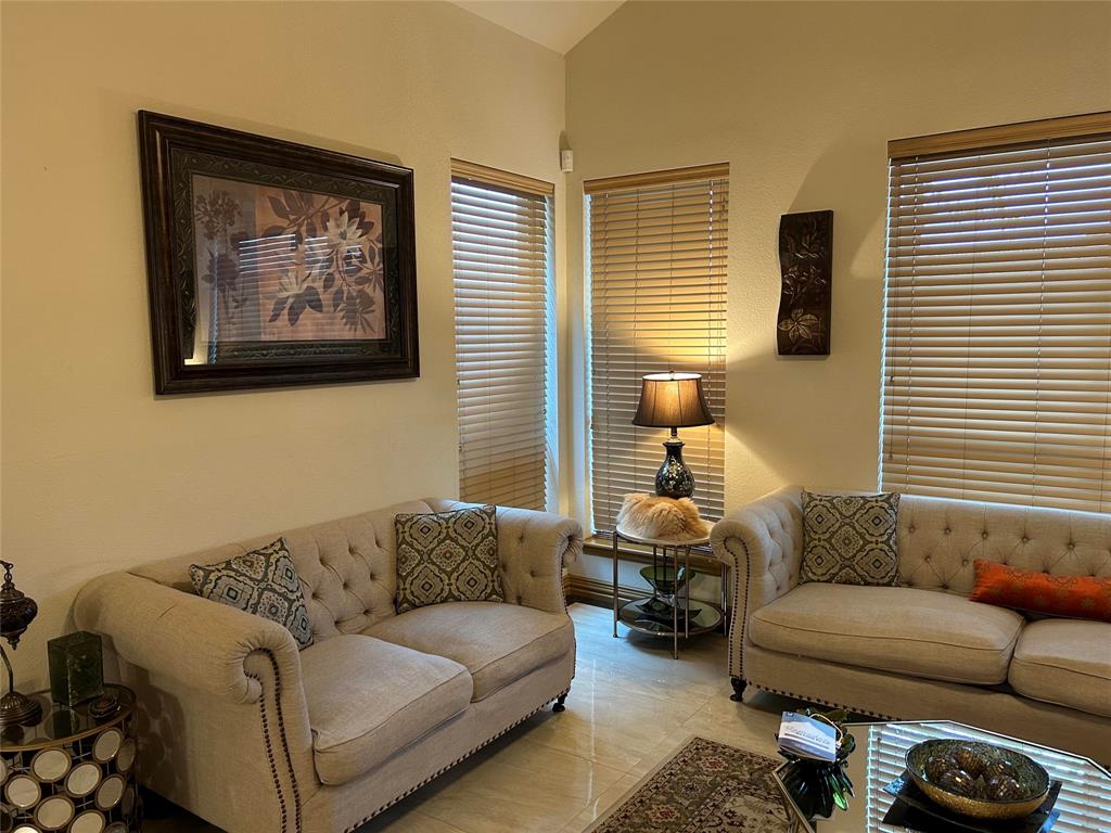 2219 Longview Road Irving, TX 75063 - Photo 15 of 36 a living room with furniture a couch and a window