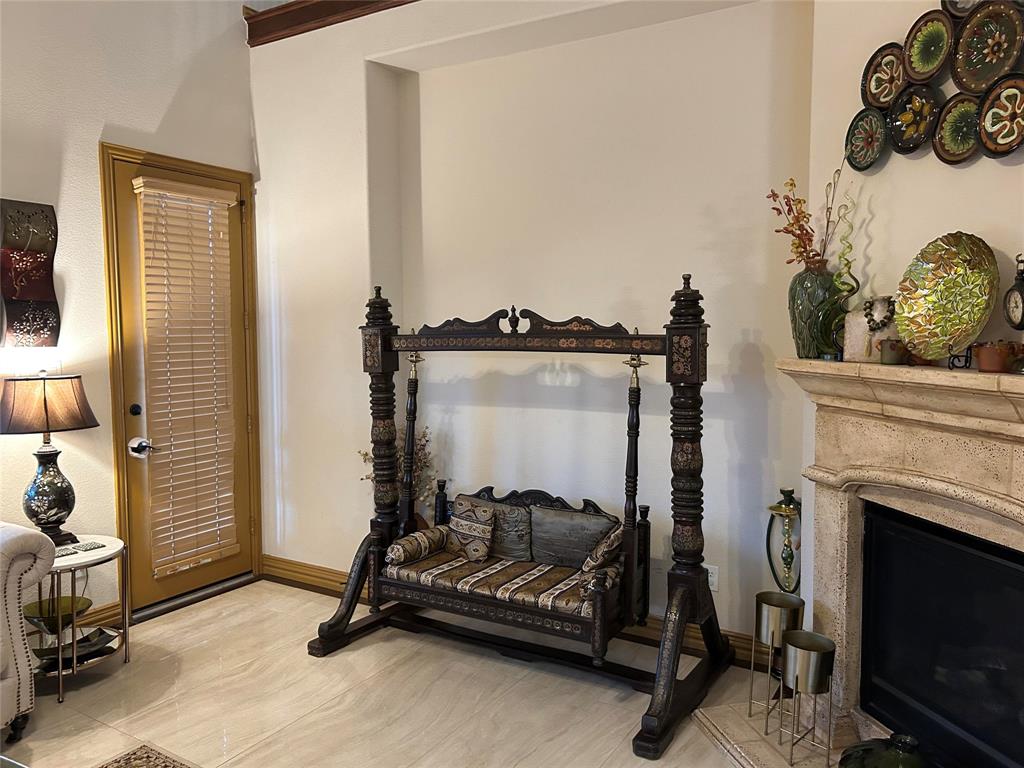 2219 Longview Road Irving, TX 75063 - Photo 17 of 36 a view of a livingroom with furniture and a fireplace