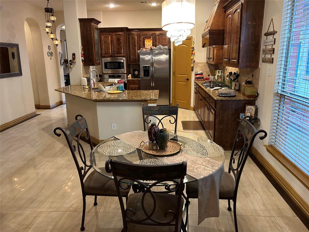 2219 Longview Road Irving, TX 75063 - Photo 20 of 36 a view of a dining room with furniture