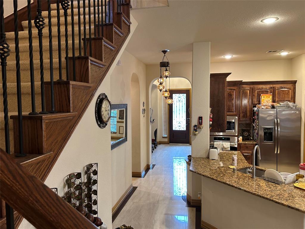 2219 Longview Road Irving, TX 75063 - Photo 21 of 36 a kitchen with sink and refrigerator