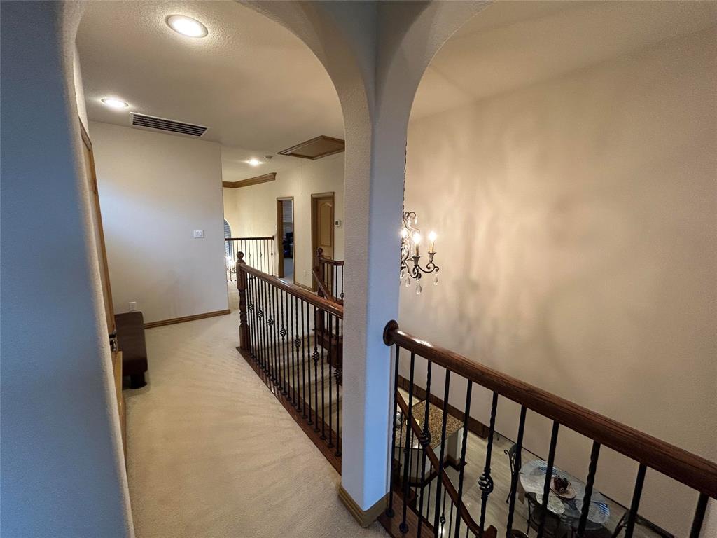 2219 Longview Road Irving, TX 75063 - Photo 24 of 36 a view of a hallway with wooden floor and stairs