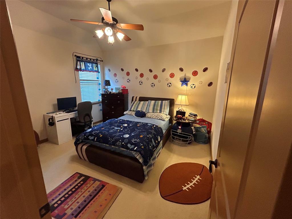 2219 Longview Road Irving, TX 75063 - Photo 25 of 36 a bedroom with furniture and a mirror