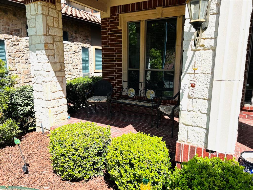 2219 Longview Road Irving, TX 75063 - Photo 4 of 36 a backyard of a house with lots of green space and glass windows