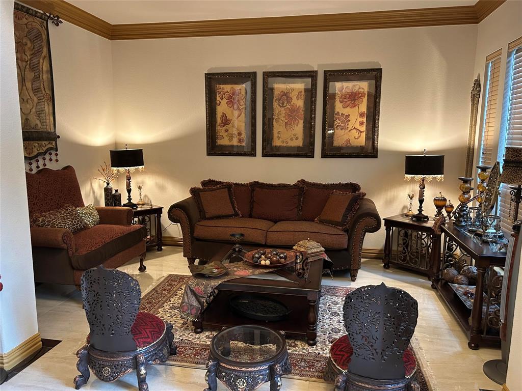 2219 Longview Road Irving, TX 75063 - Photo 9 of 36 a living room with furniture a lamp and a window