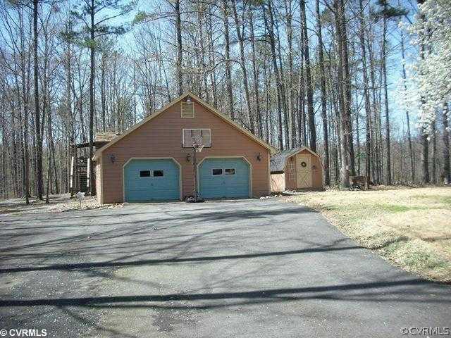 7110 Ledo Road Moseley, VA 23120 - Photo 10 of 12 Storage - Large 2 car garage with full attic above and 1 car garage attached in rear. Also, one of the two storage sheds shown.