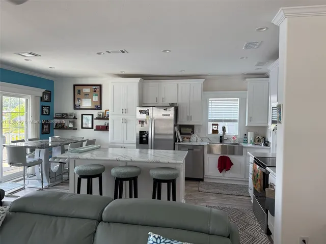 a kitchen with a stove a refrigerator and a refrigerator