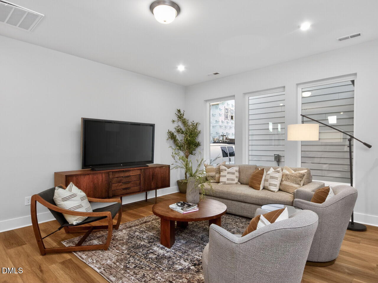 13 Tallgrass Road Pittsboro, NC 27312 - Photo 11 of 34 a living room with furniture and a flat screen tv