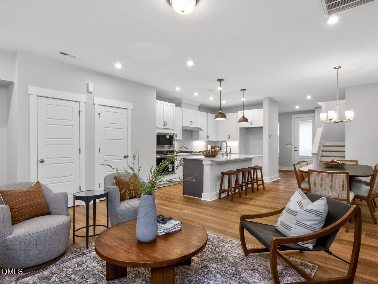 13 Tallgrass Road Pittsboro, NC 27312 - Photo 13 of 34 a living room with fireplace furniture and a dining table